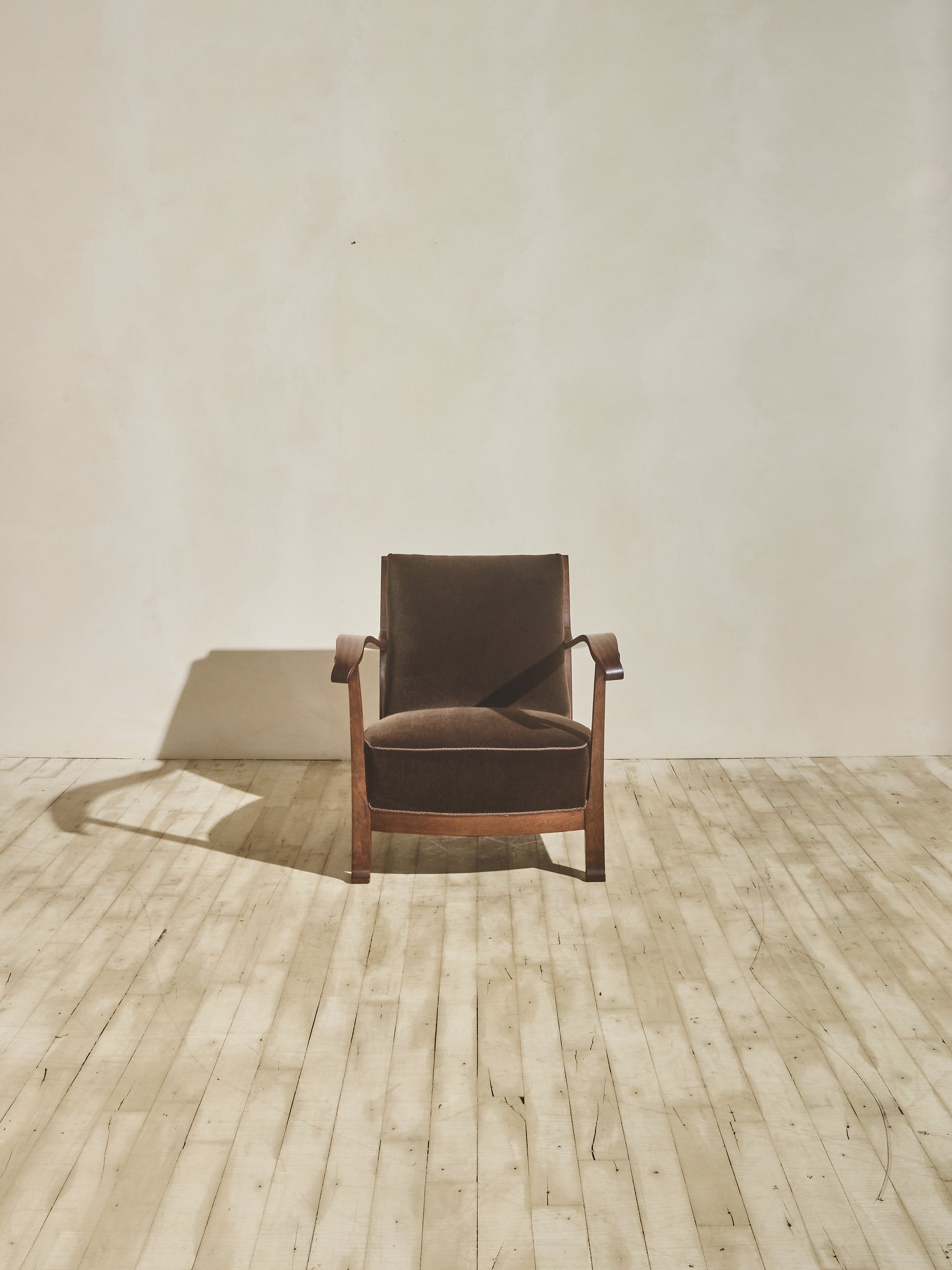 1930's brown Danish art décor armchair with thin curved details.