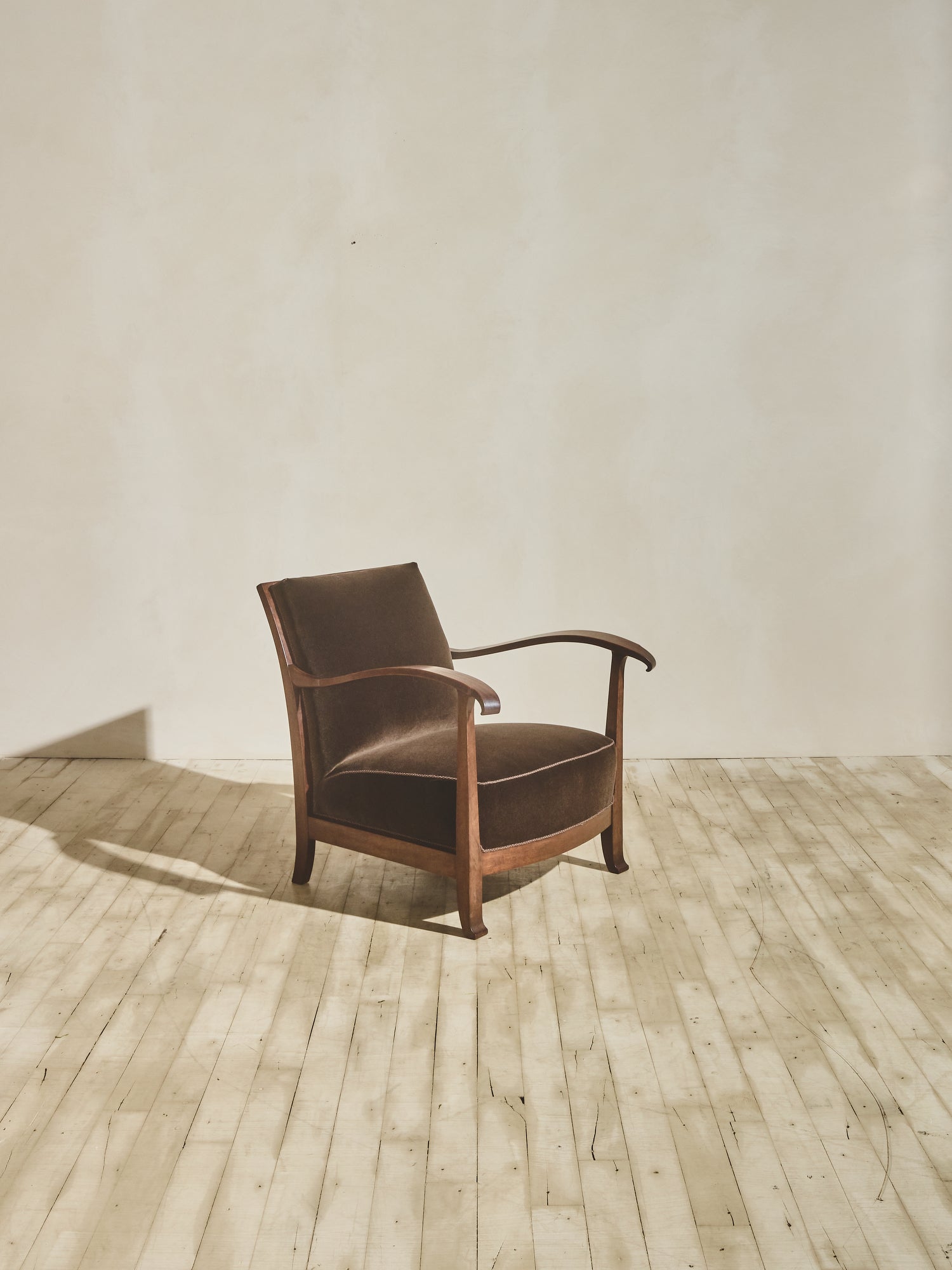 1930's brown Danish art décor armchair with thin curved details.