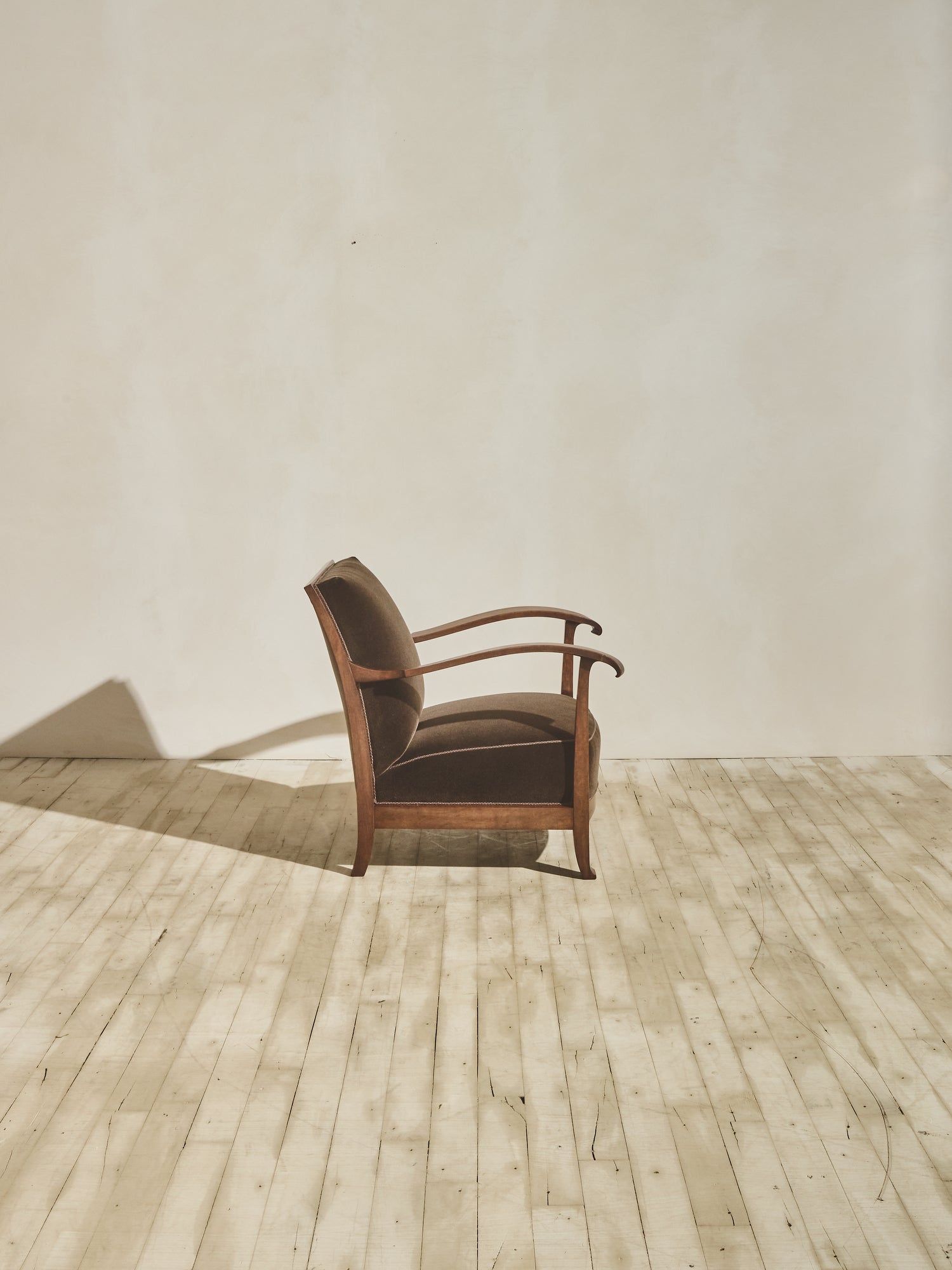 1930's brown Danish art décor armchair with thin curved details.