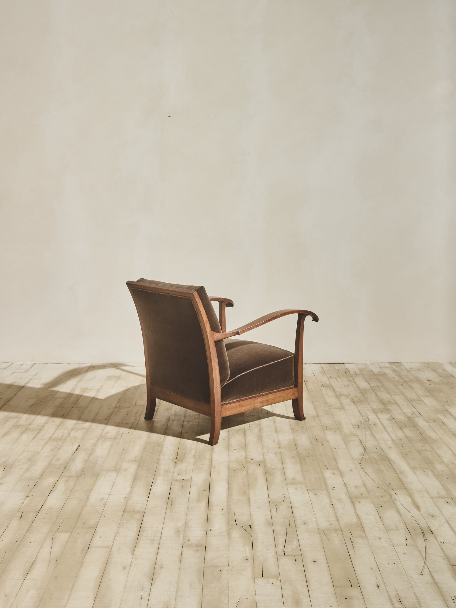 1930's brown Danish art décor armchair with thin curved details.