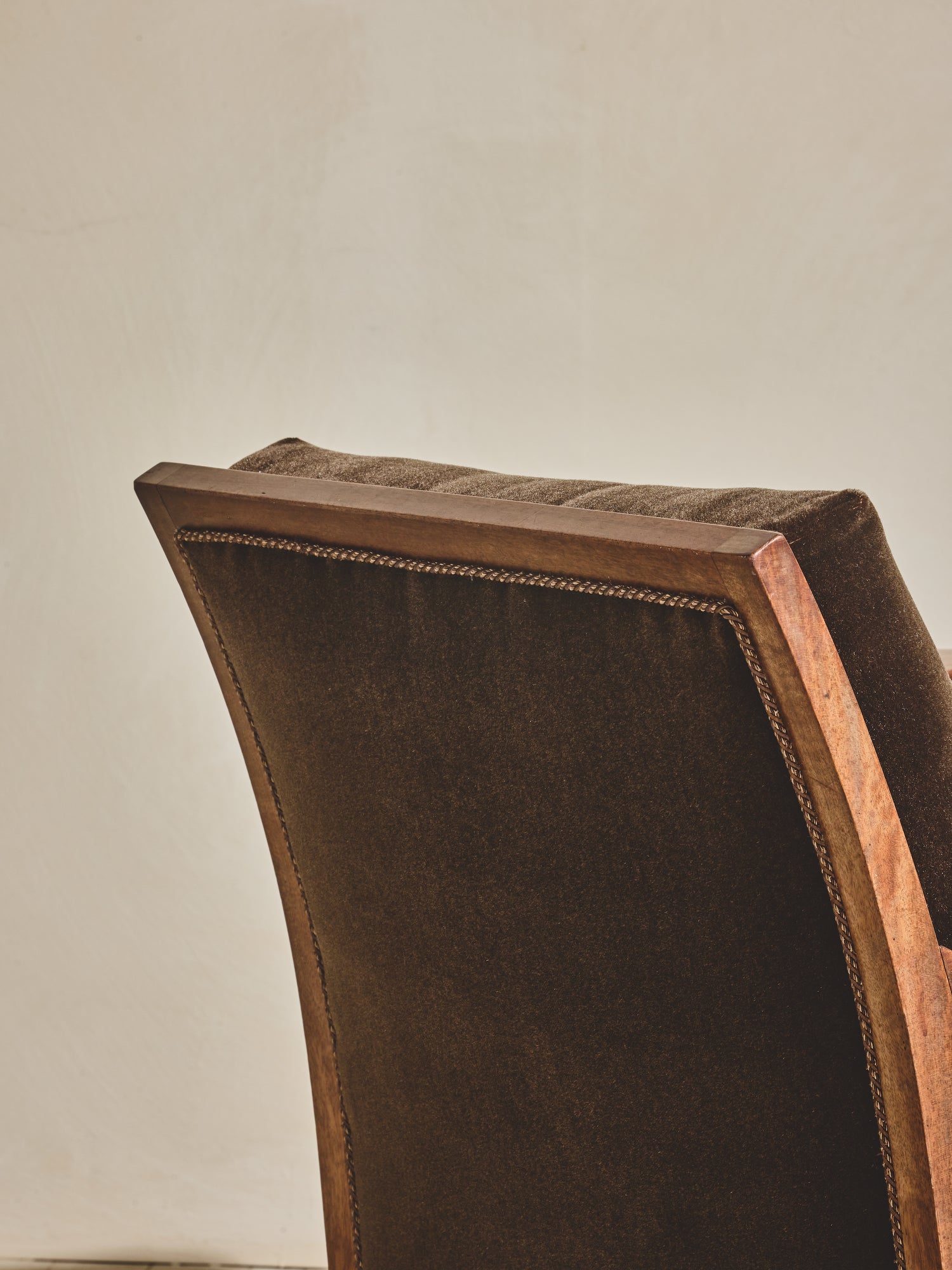 1930's brown Danish art décor armchair with thin curved details.