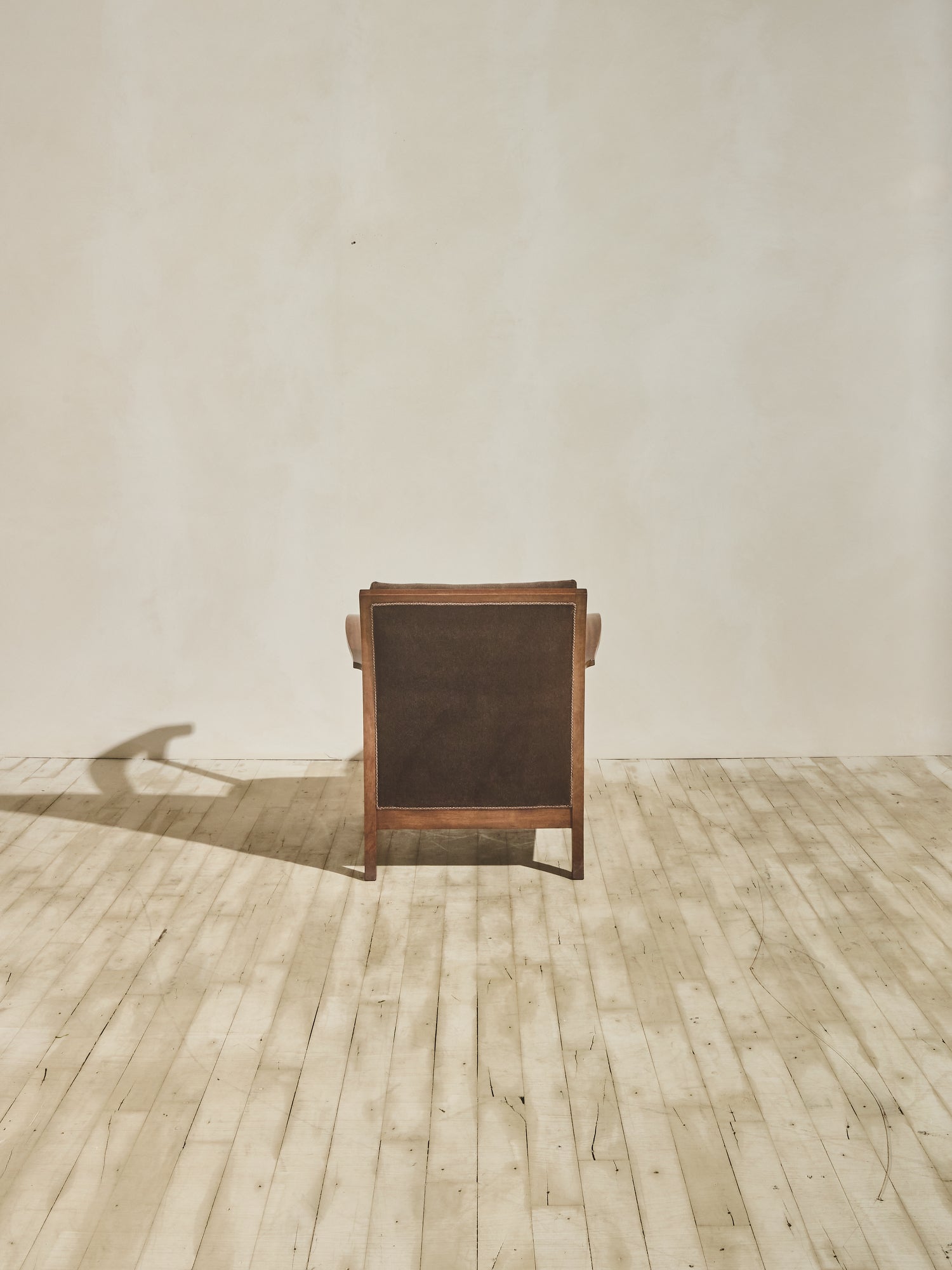 1930's brown Danish art décor armchair with thin curved details.