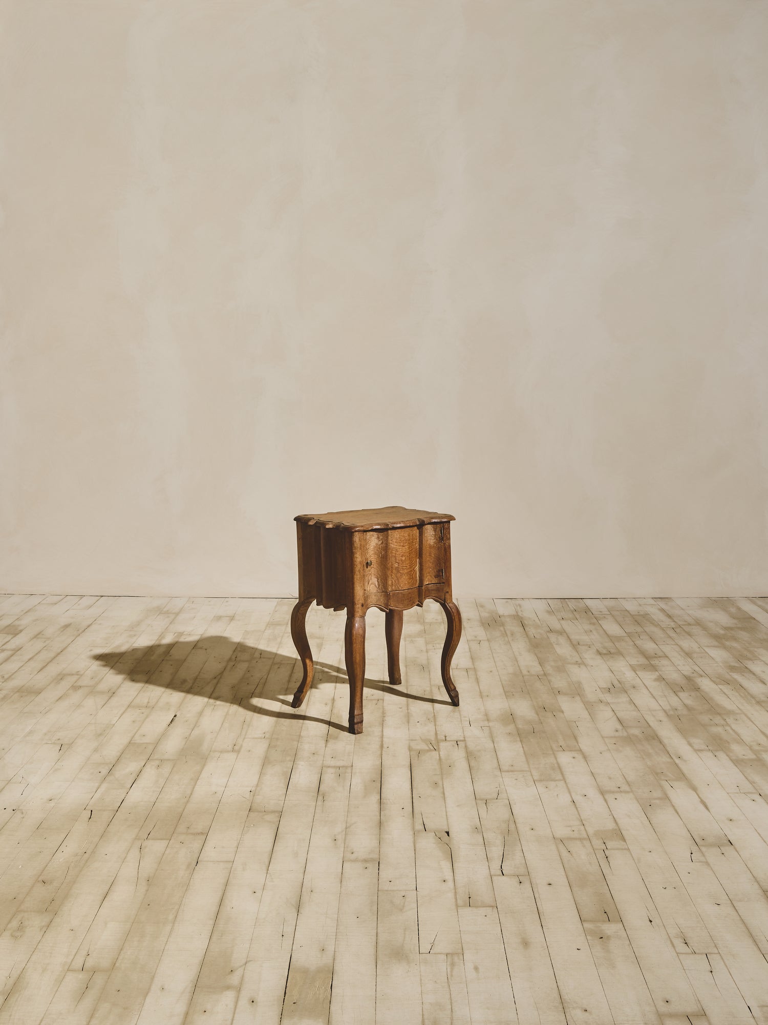 Baroque solid oak side table with fluted sides, wavy oak grain pattern, and hand sculpted XV French style legs.