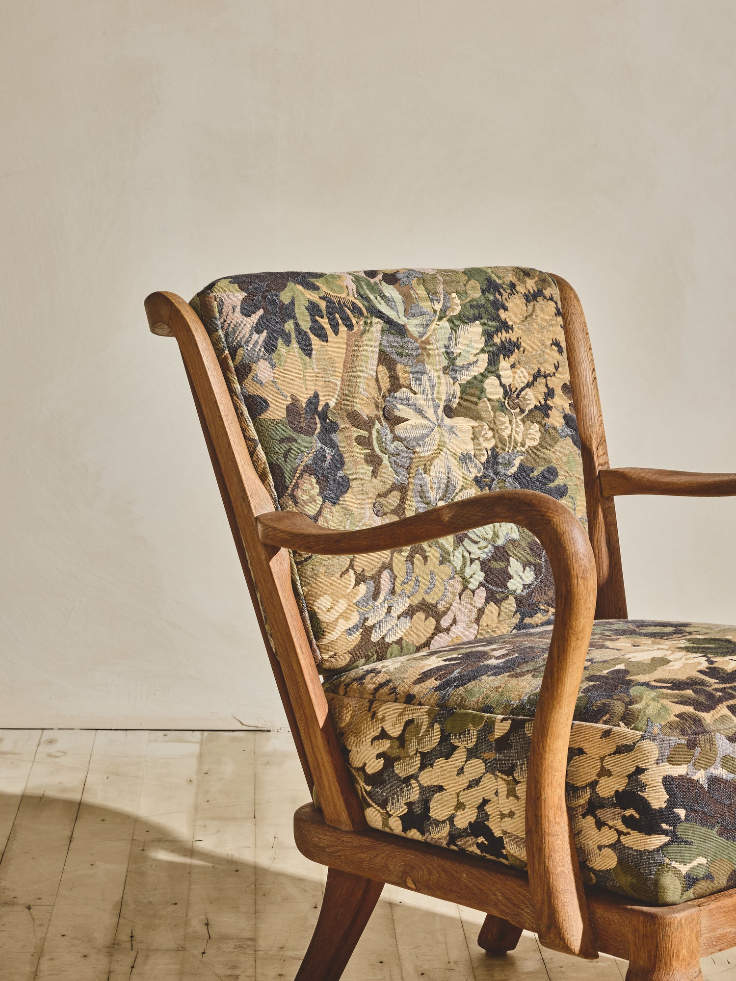 Alfred Christensen Chair with rounded armrests and a slatted back.