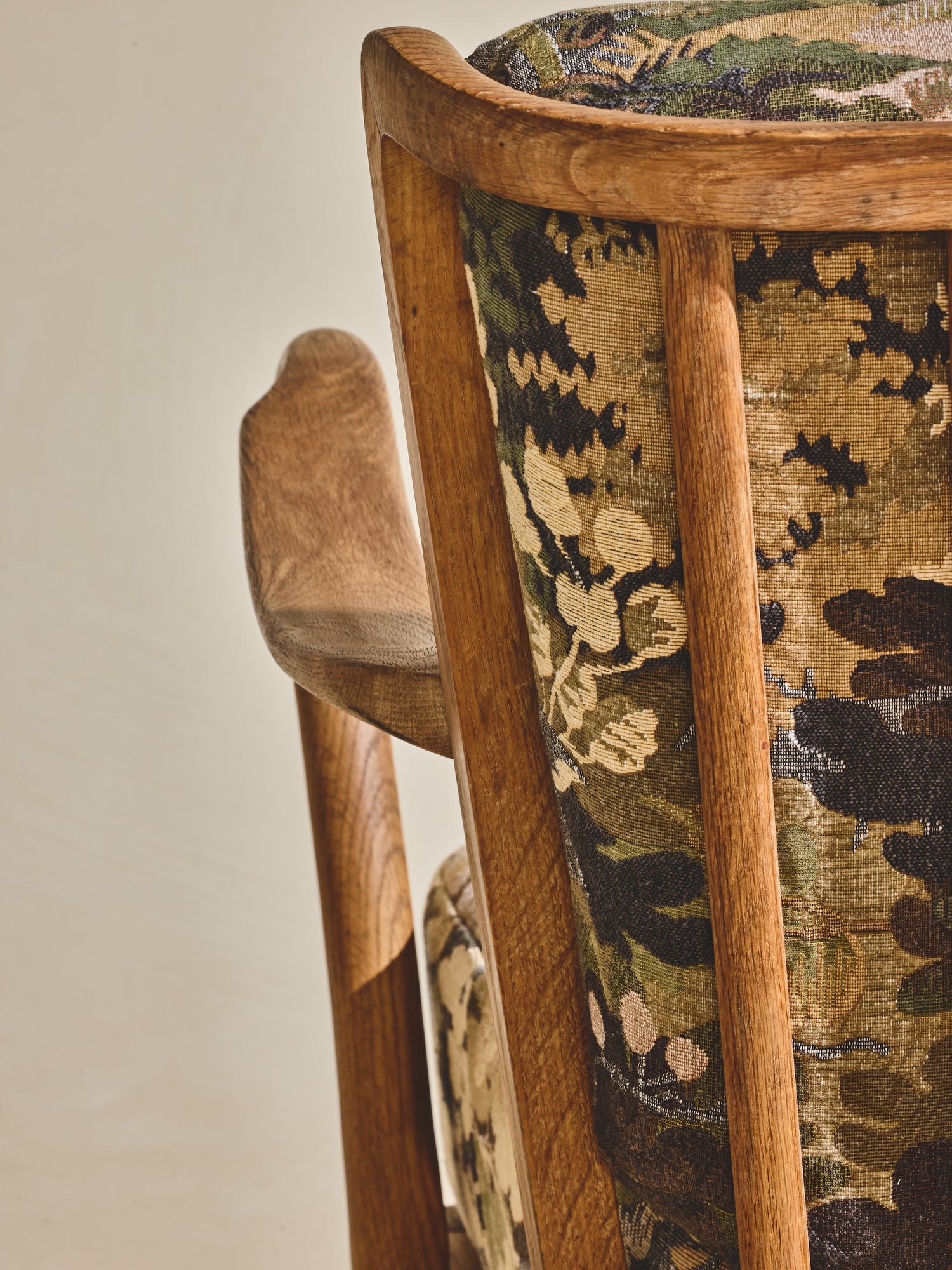 Alfred Christensen Chair with rounded armrests and a slatted back.