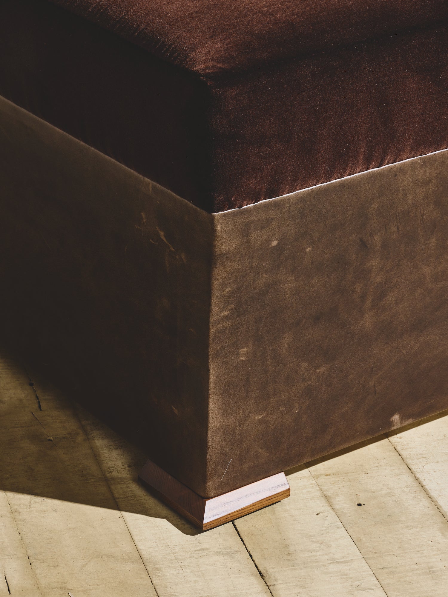 Close up of brutalist style Bromley Ottoman in cigar fabric.