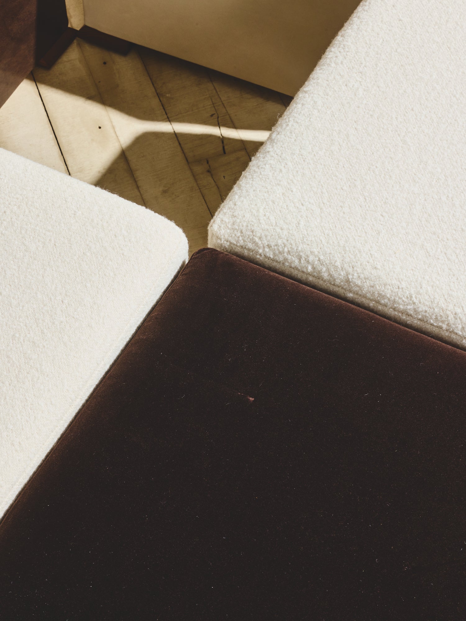 Close up of comfort seating on the Bromley Ottoman in crema/cigar fabric.