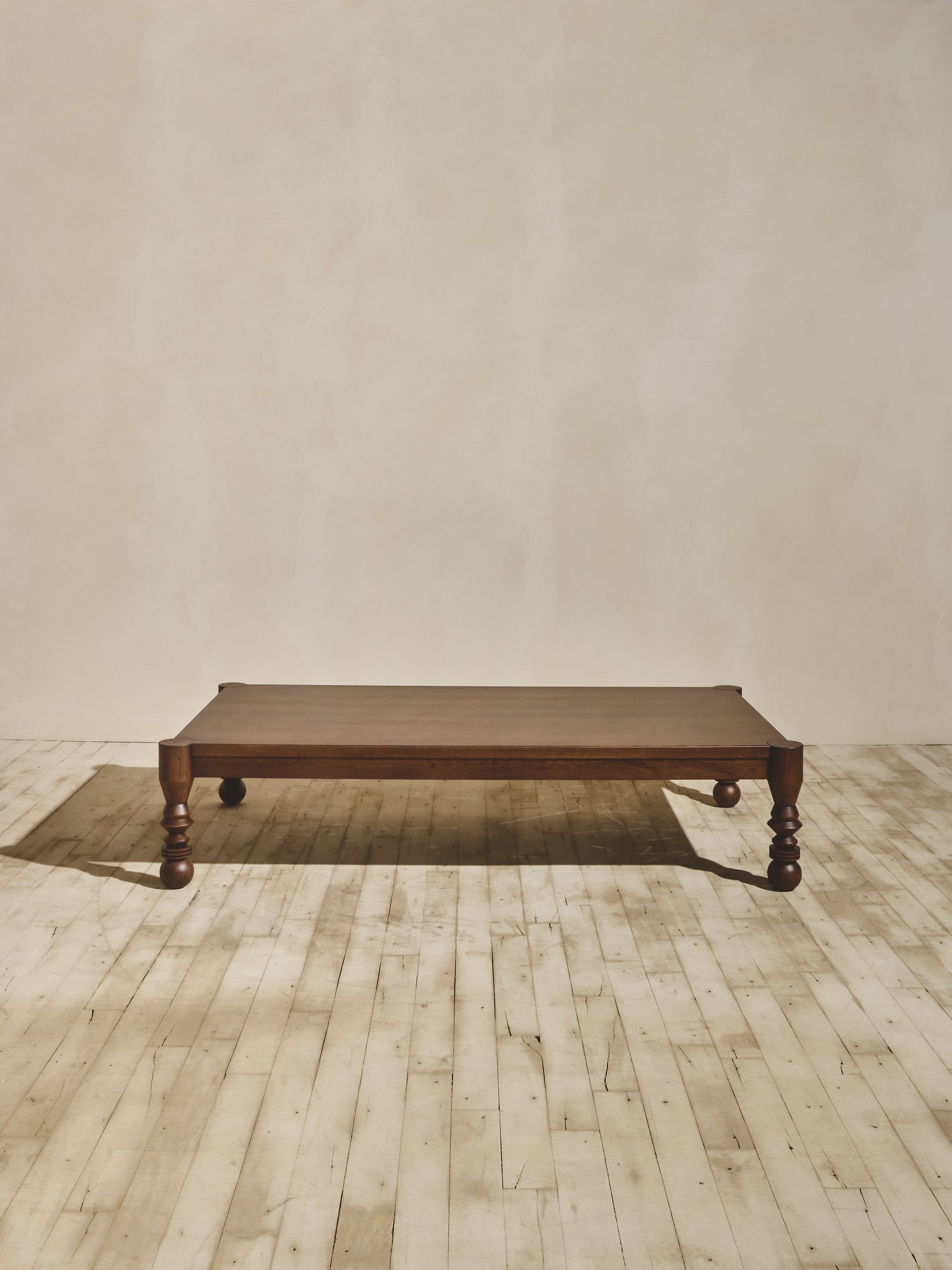 Modern style NBL Dining Room Table in ebony staining featuring unique leg turnings.