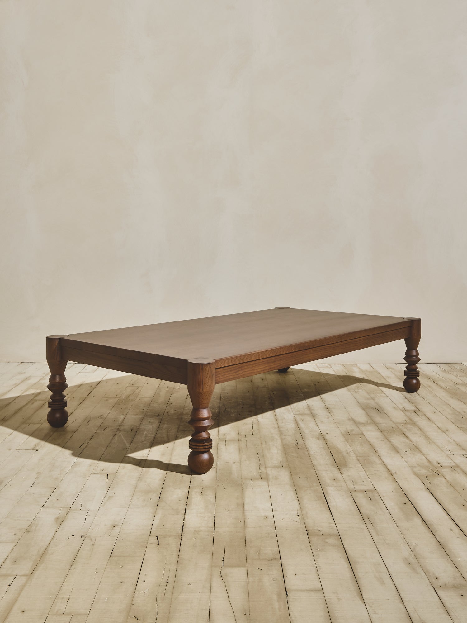 Modern style NBL Dining Room Table in ebony staining featuring unique leg turnings.