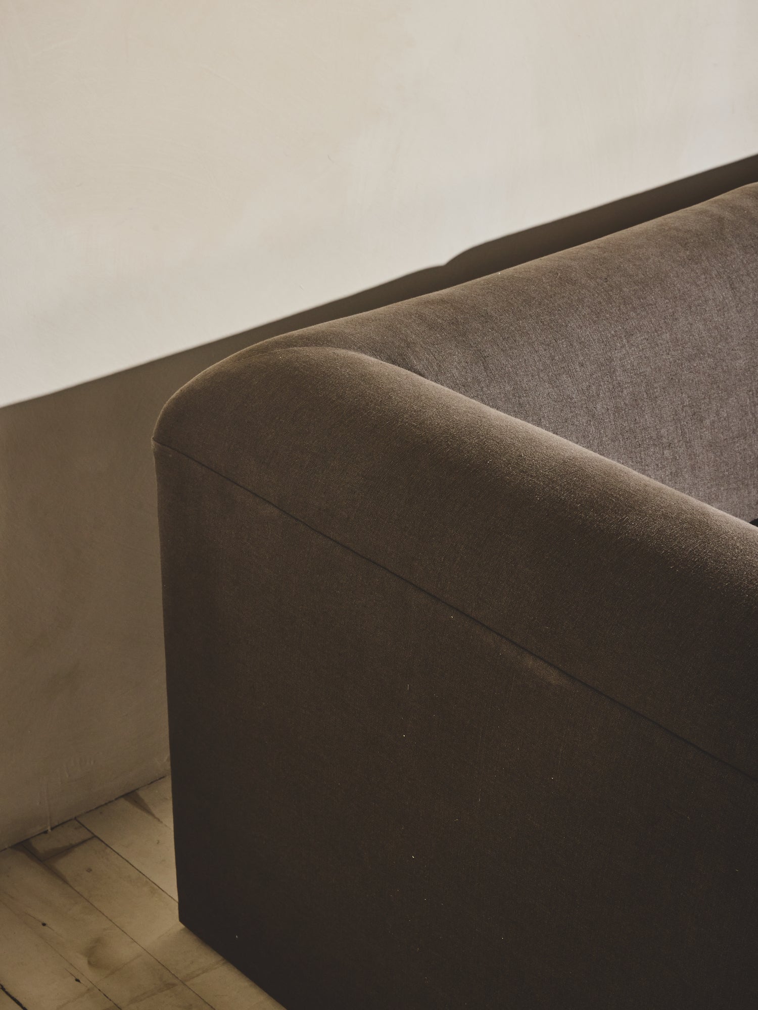 Close up of the head rest and backing upholstered fabric on the Sabi Sectional.