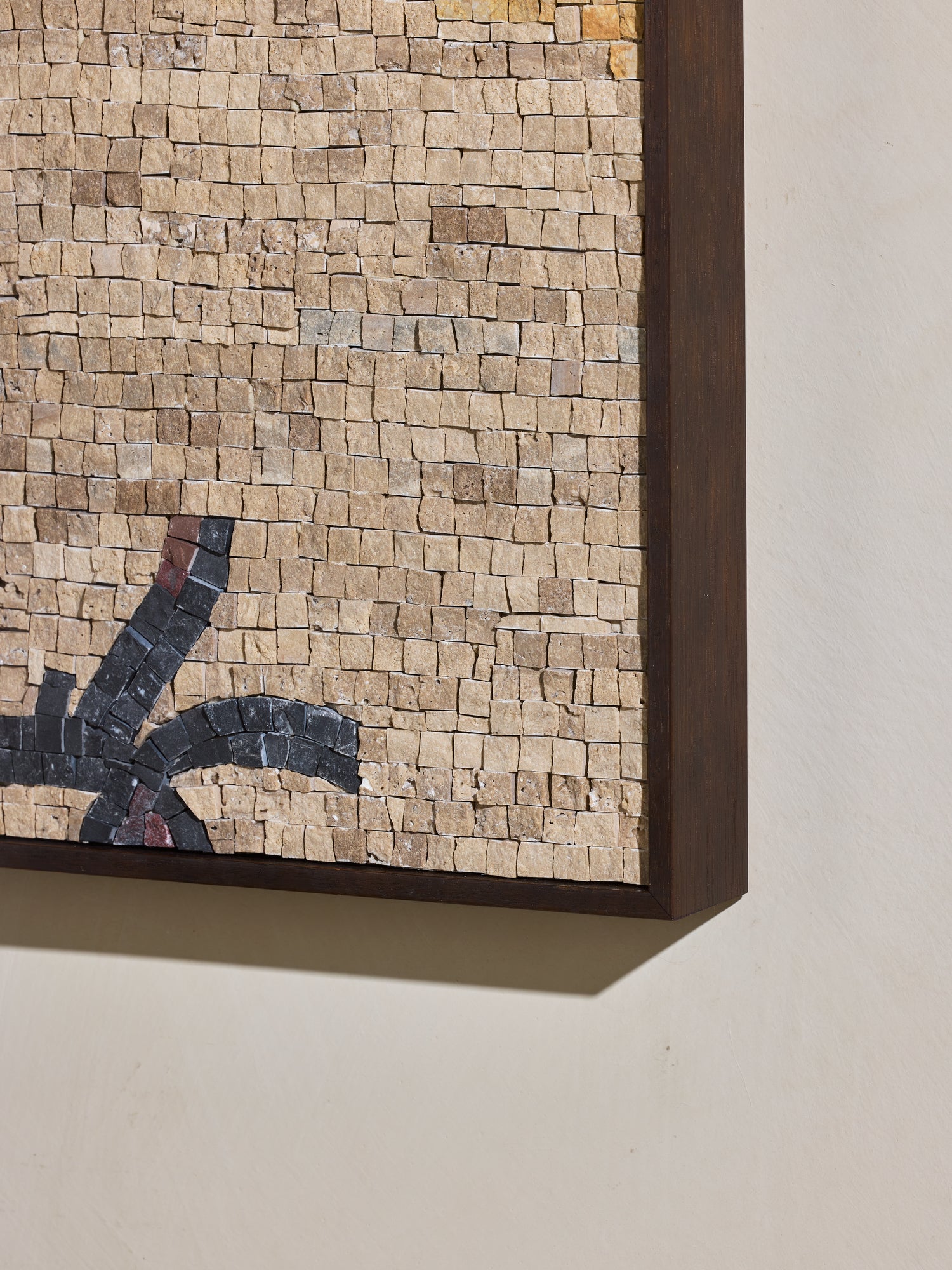 Close up of hand cut and applied stone on mosaic square stone artwork.
