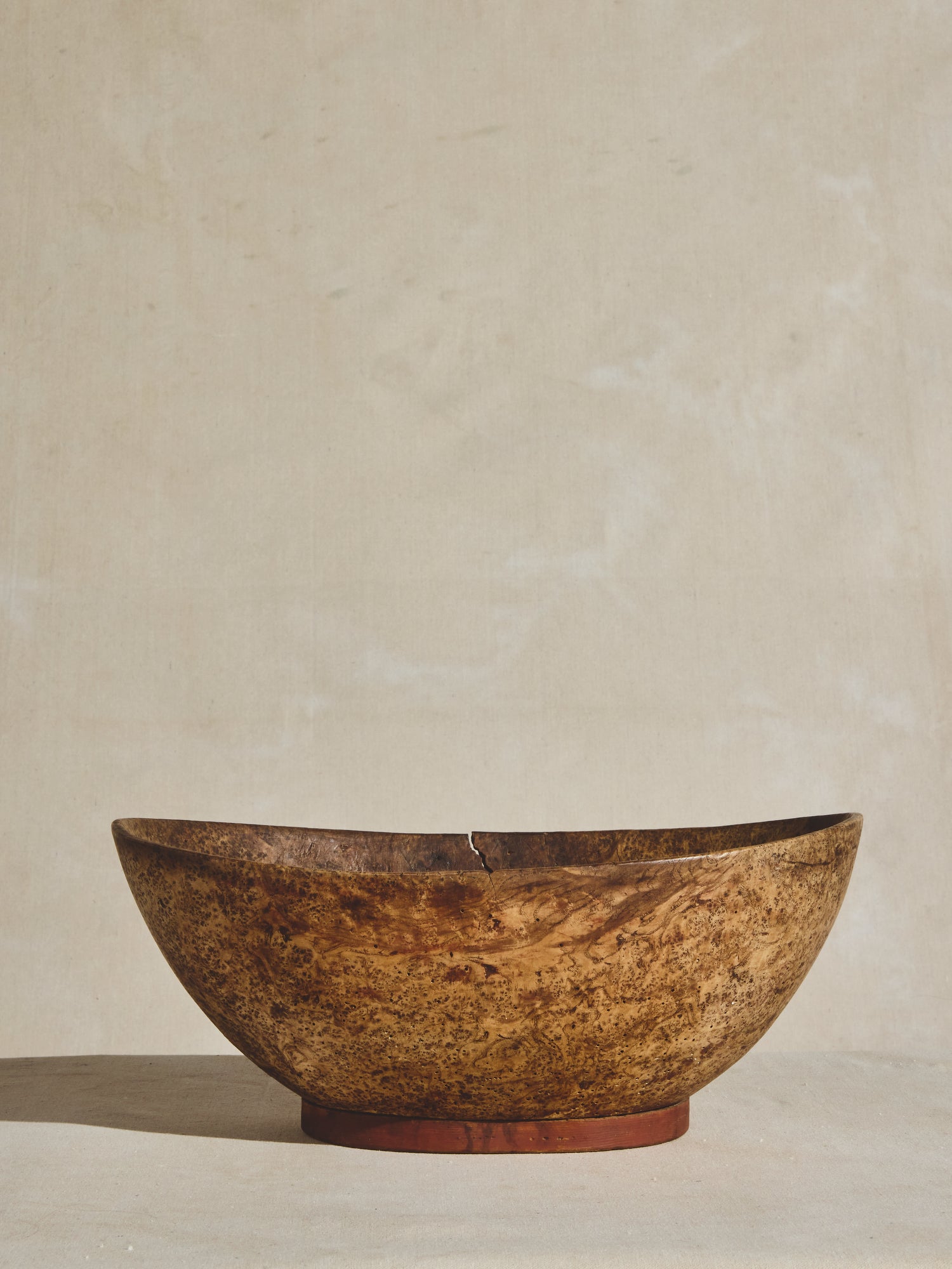 A large antique burled wood bowl