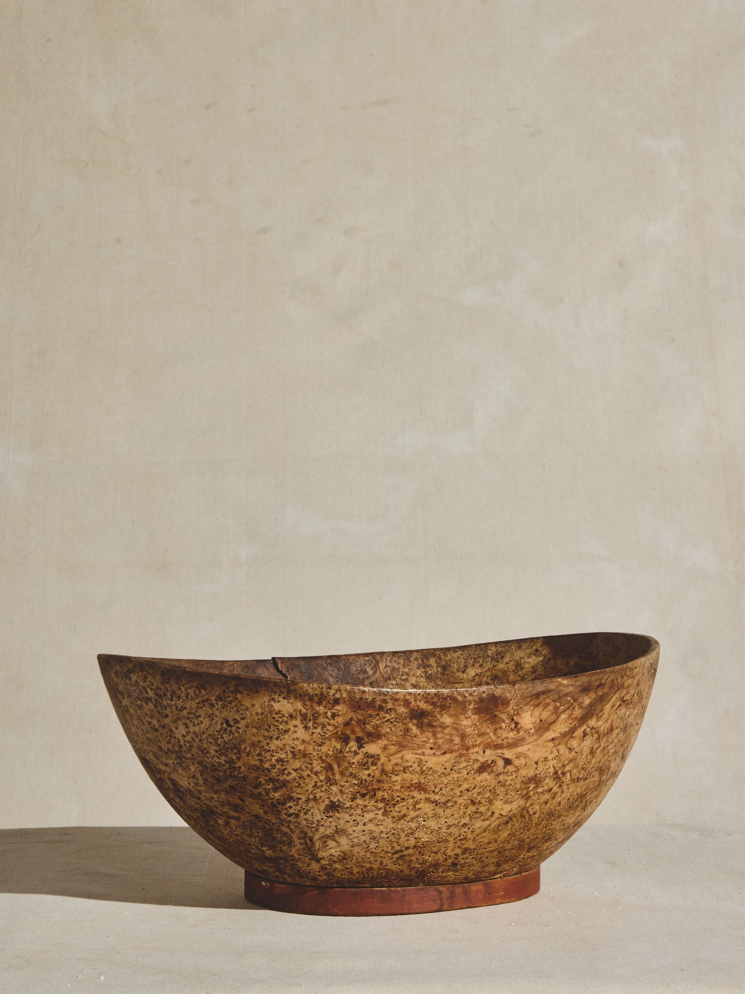A large antique burled wood bowl