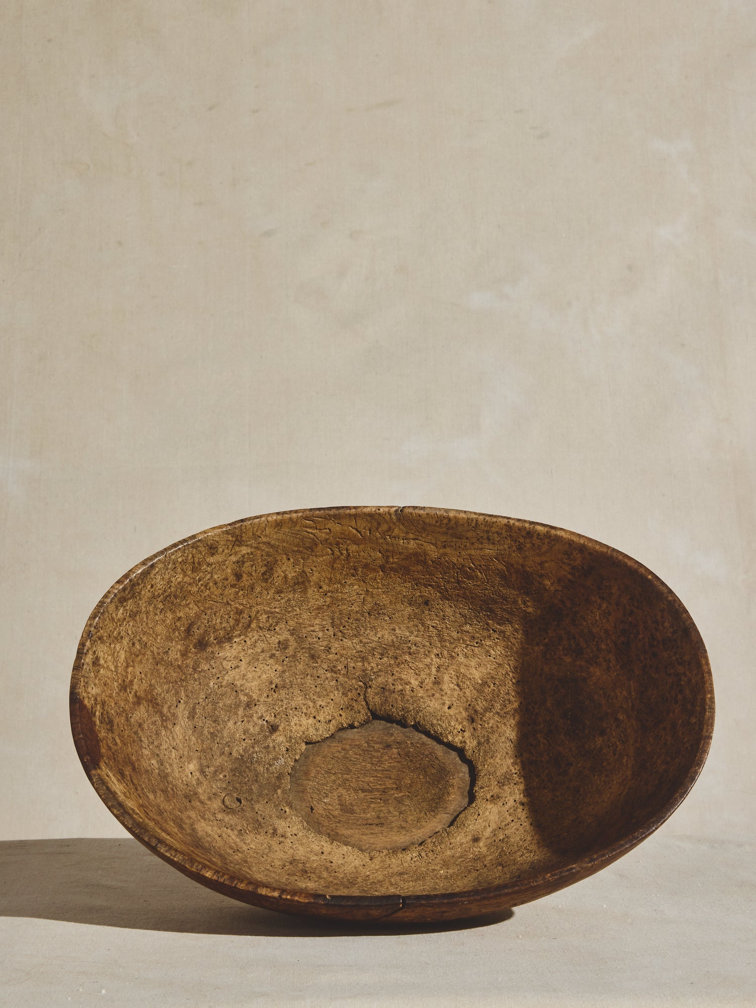 A large antique burled wood bowl