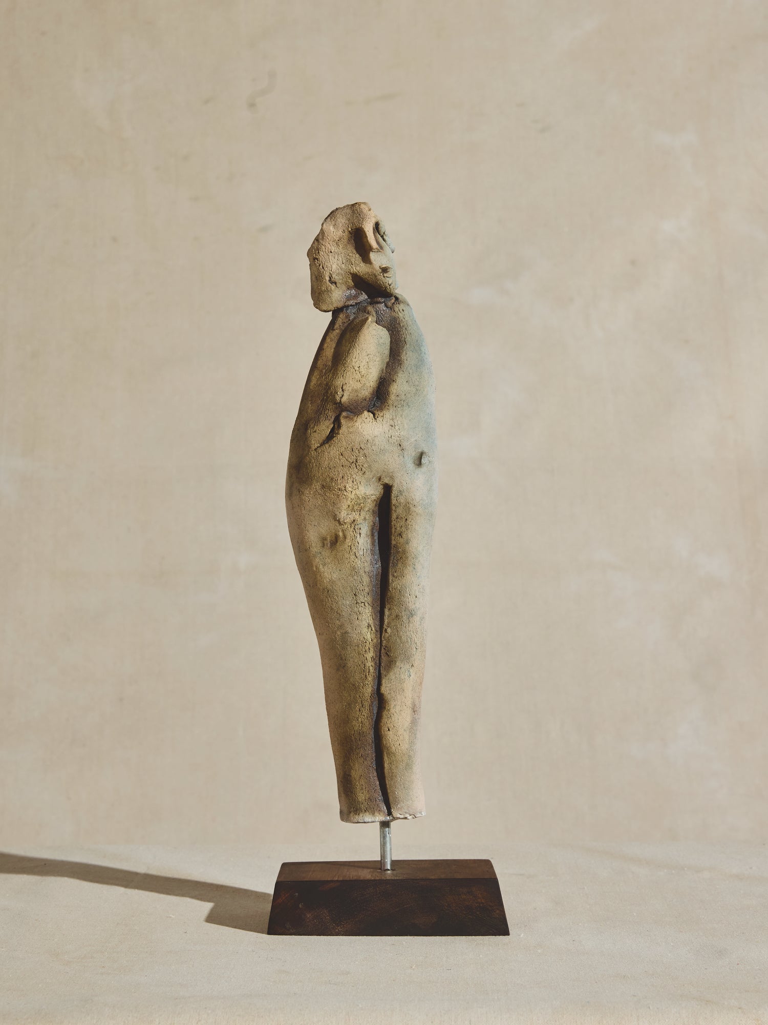 Abstract ceramic sculpture figure on wood pedestal, artist OZwaig