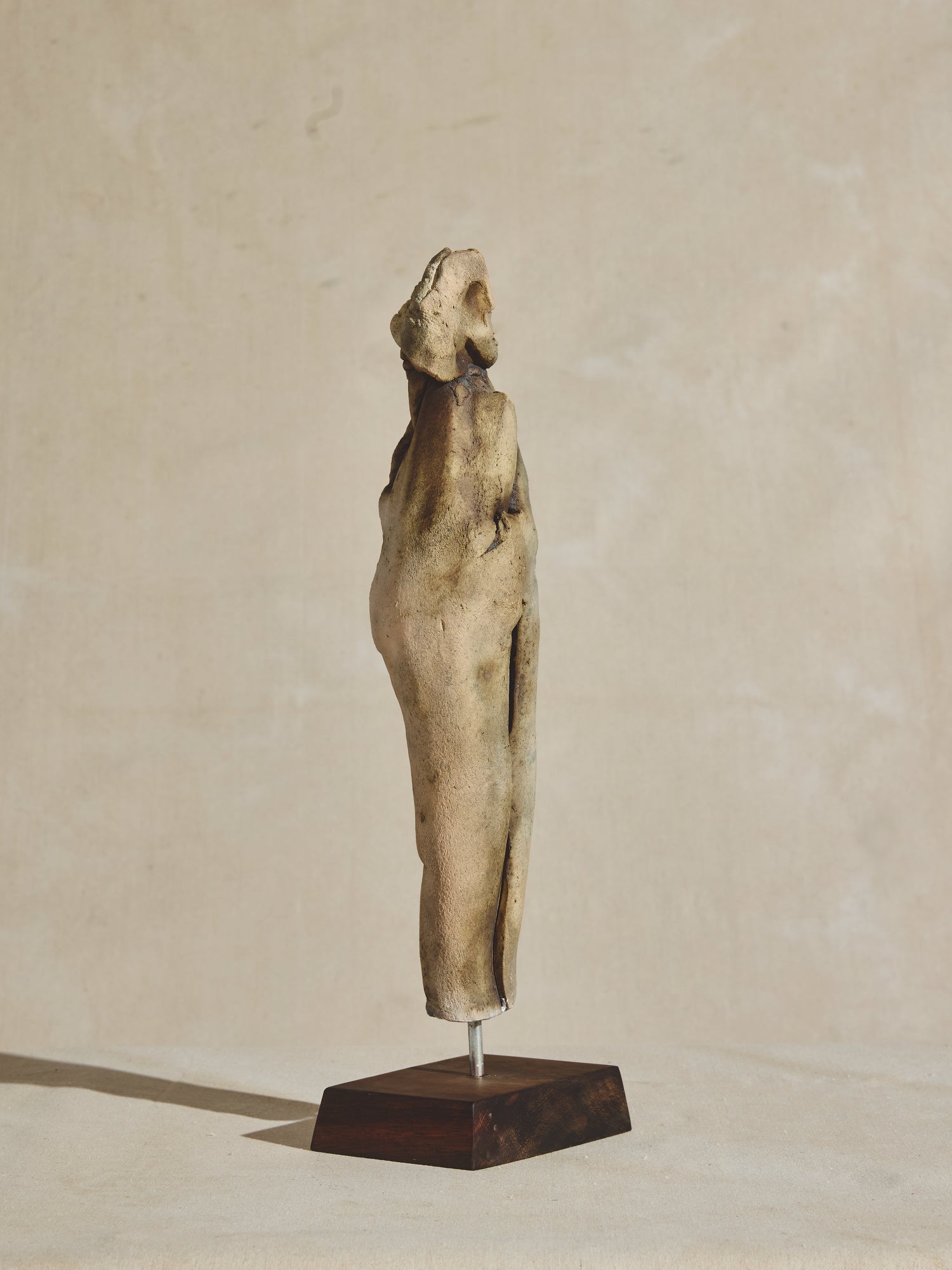 Abstract ceramic sculpture figure on wood pedestal, artist OZwaig