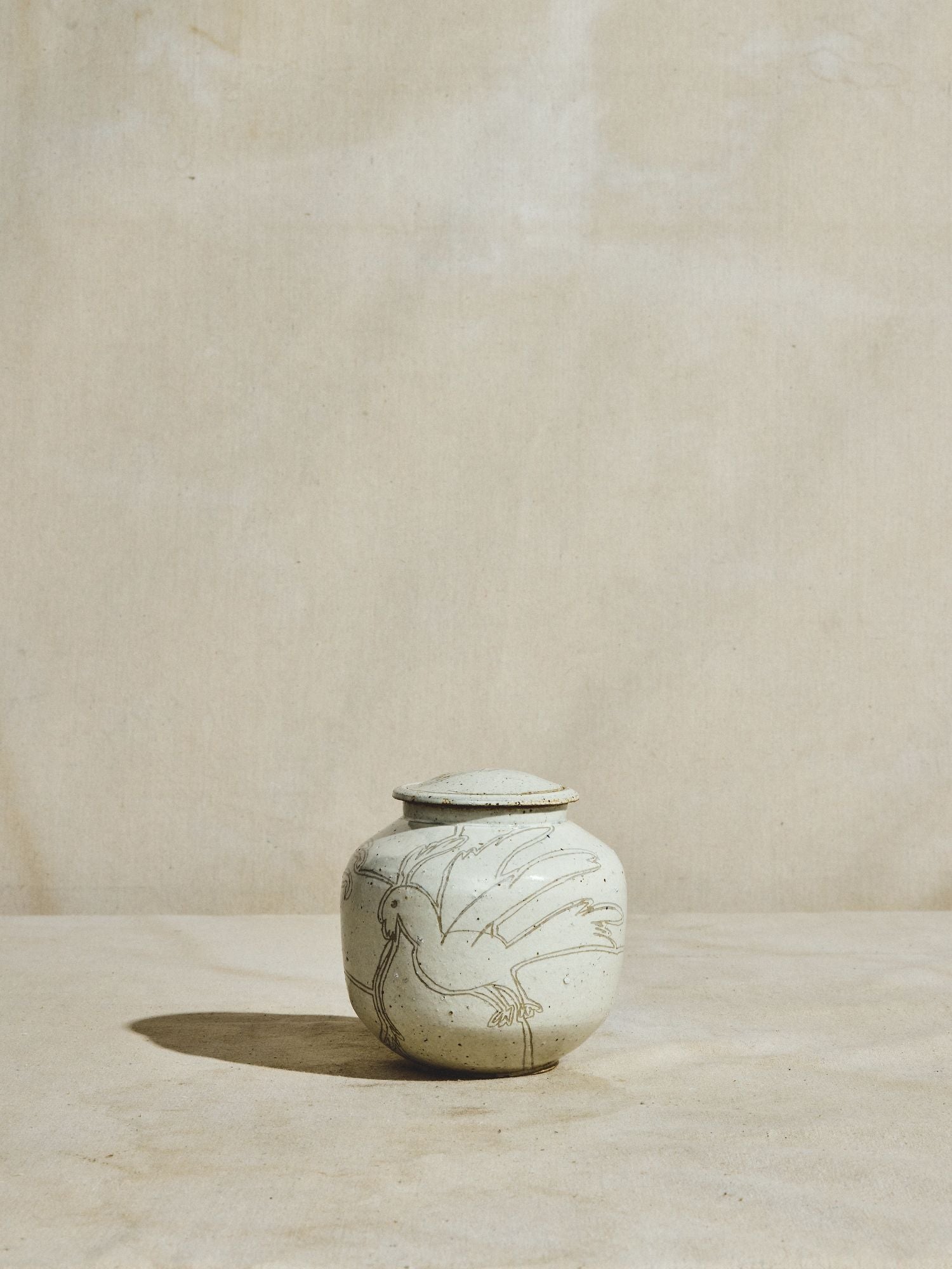 Incised Stoneware Bird Jar