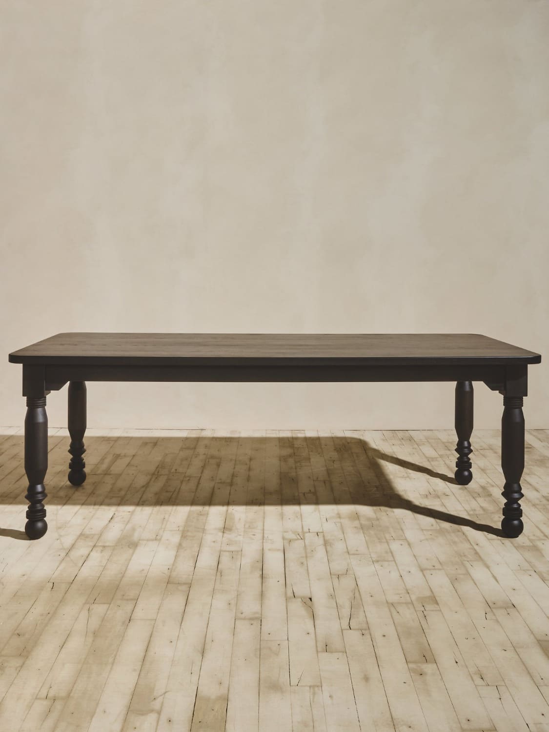 Vintage style oak coffee table with custom turned legs, stained in medium brown.