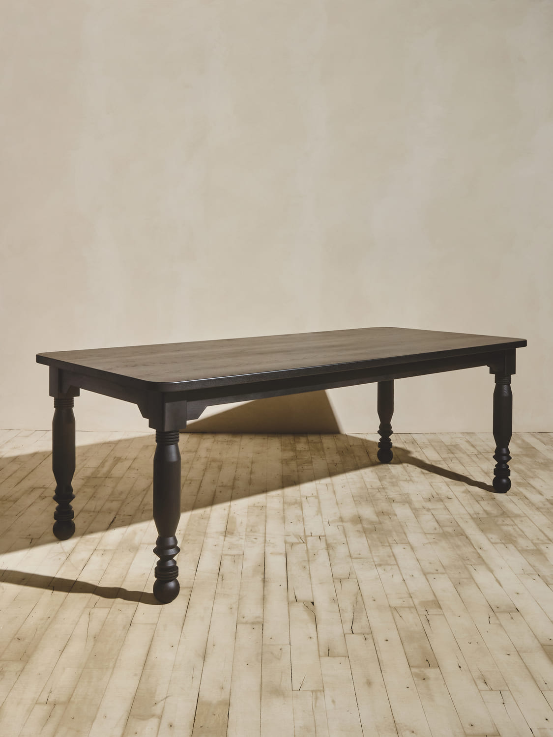 Vintage style oak coffee table with custom turned legs, stained in medium brown.