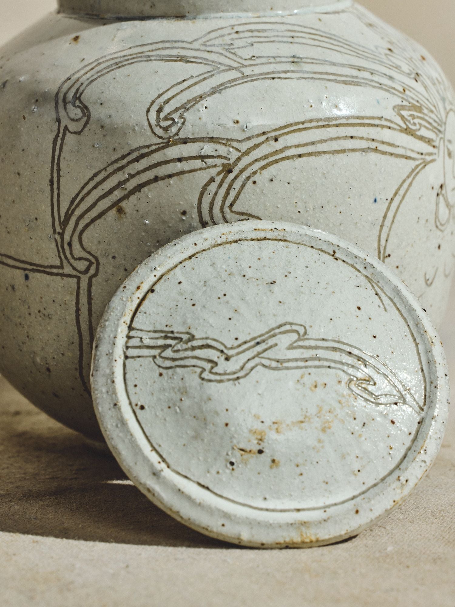 Incised Stoneware Bird Jar