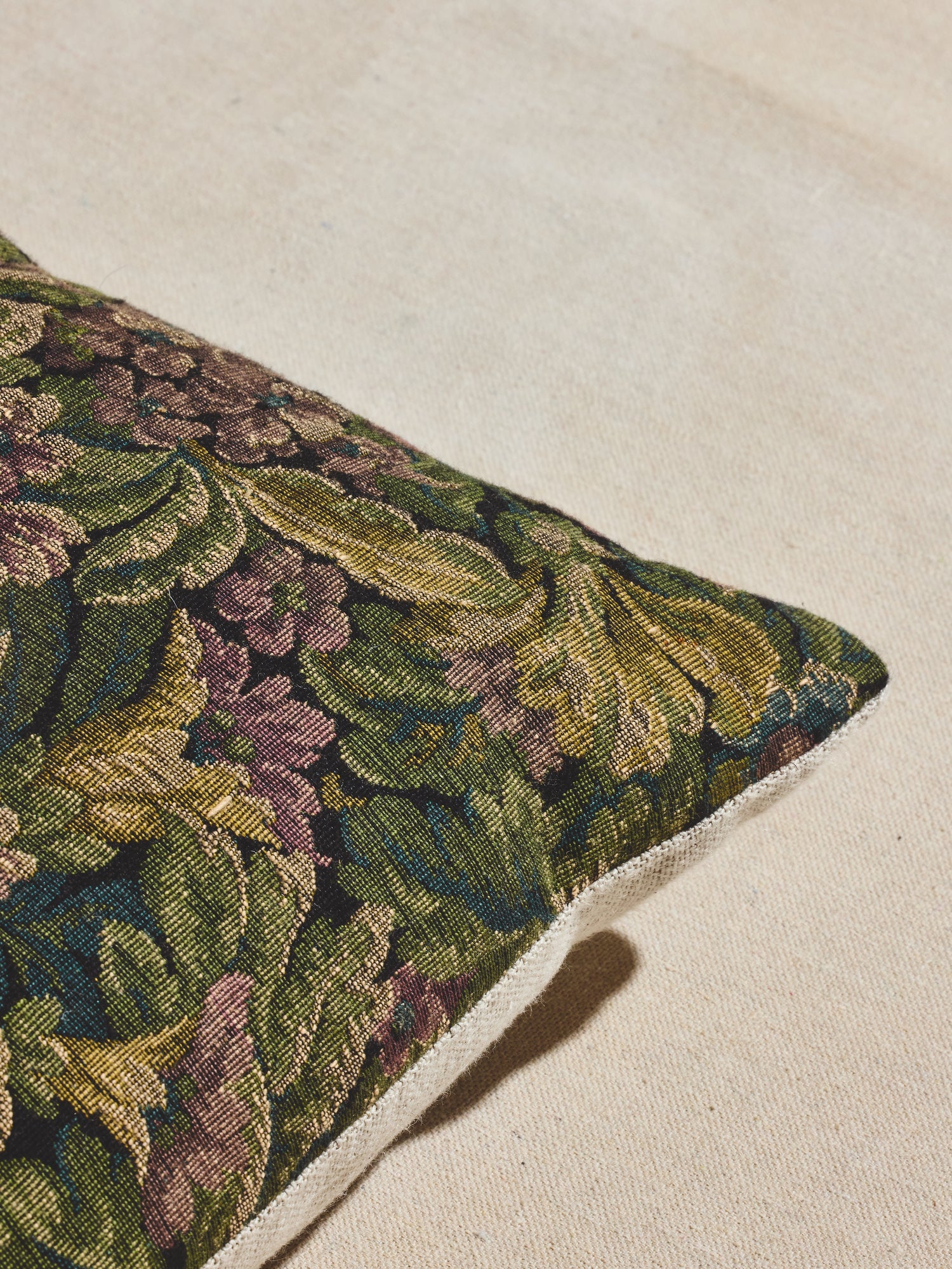 Bayou bloom vintage floral lumbar pillow in green, blue, lilac, and ochre.