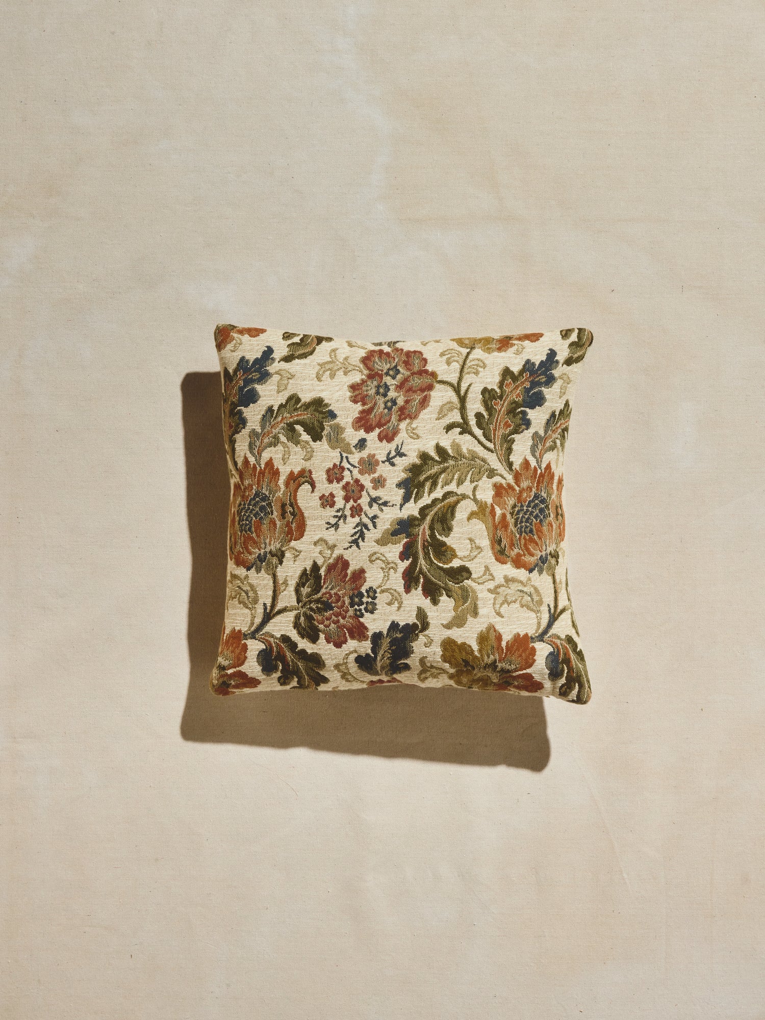 Vintage style floral pattern on our woven square Primavera pillow and down feather blend insert.