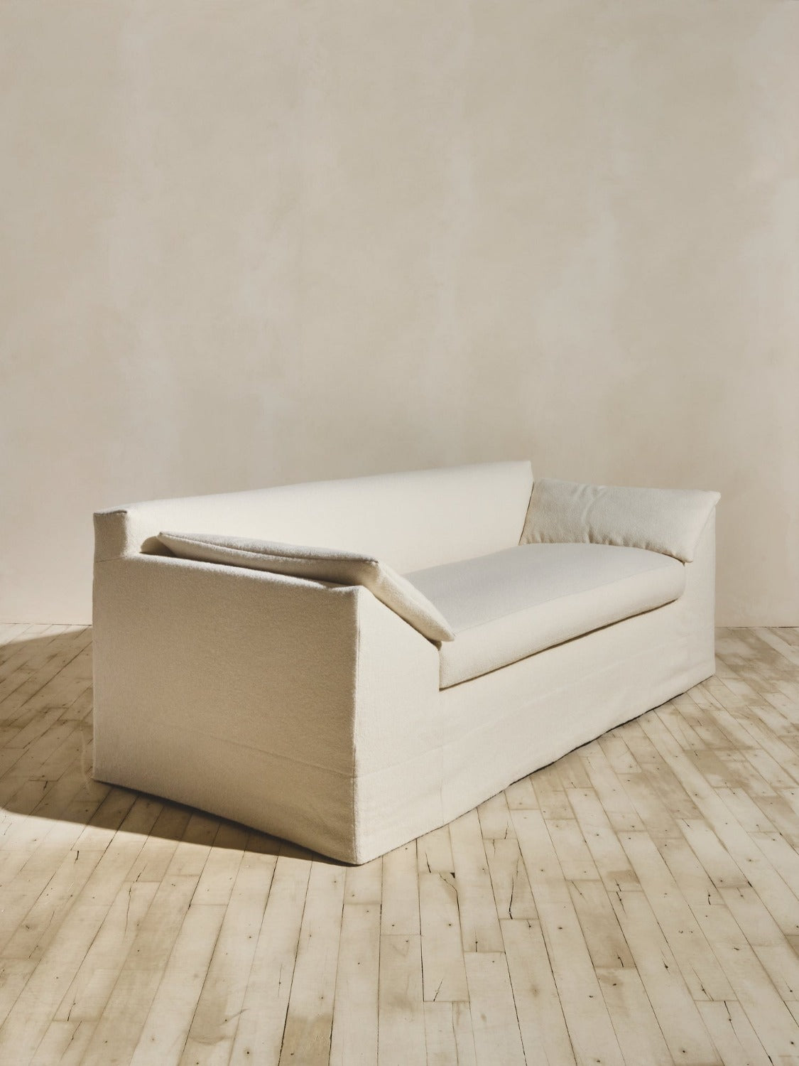 Side view of the Bromley Sofa in our crema fabric.