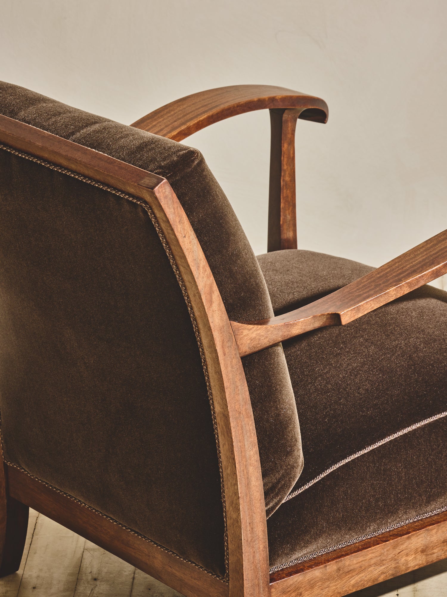 1930's brown Danish art décor armchair with thin curved details.