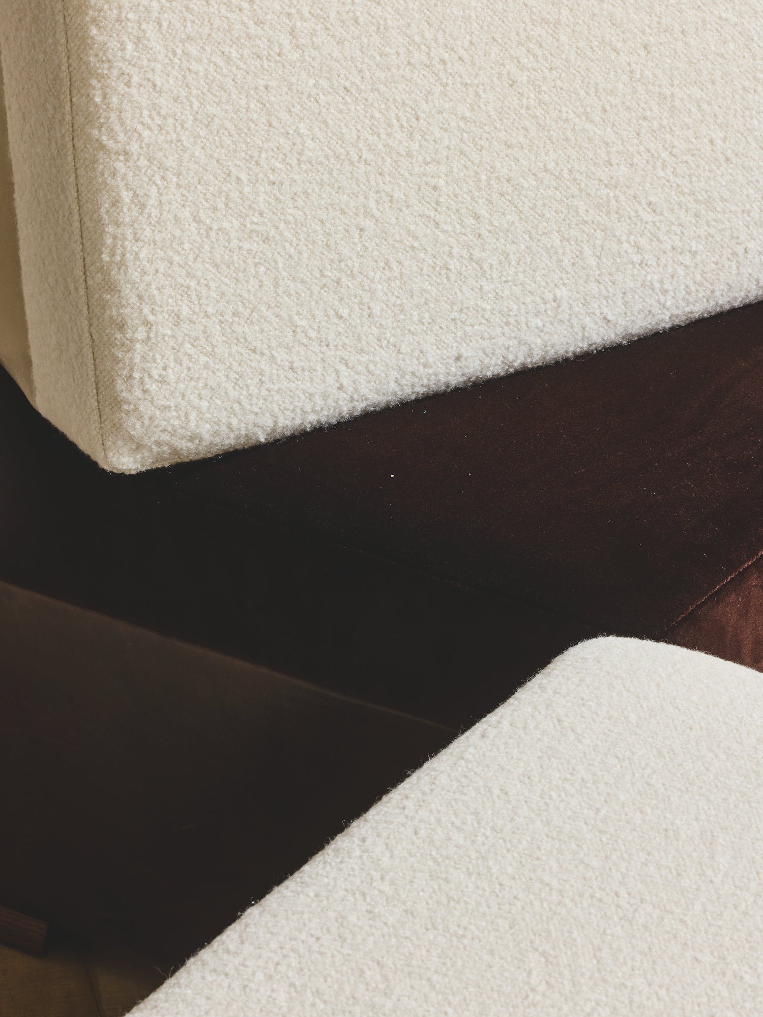 Close up of comfort seating on the Bromley Ottoman in crema/cigar fabric.