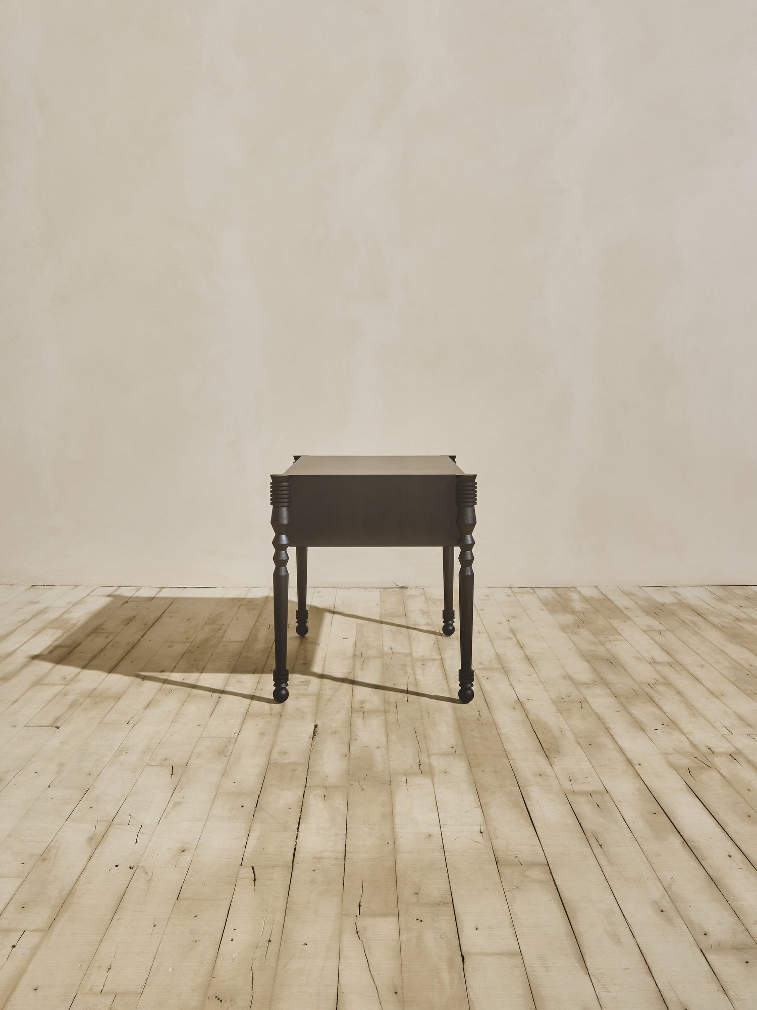 Side view of modern style wooden Disc Side Table with opened drawer, in ebony finish.