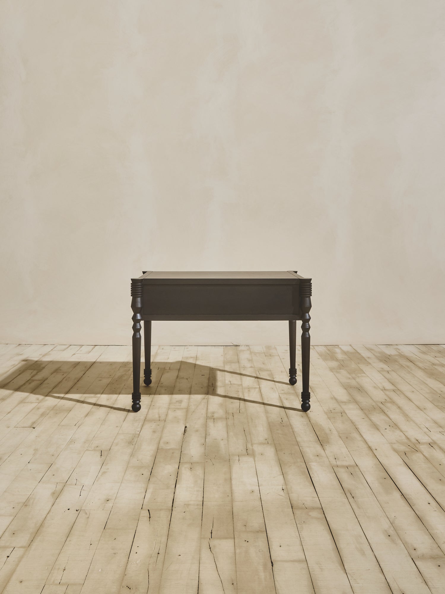 Side view of modern style wooden Disc Side Table in ebony finish.