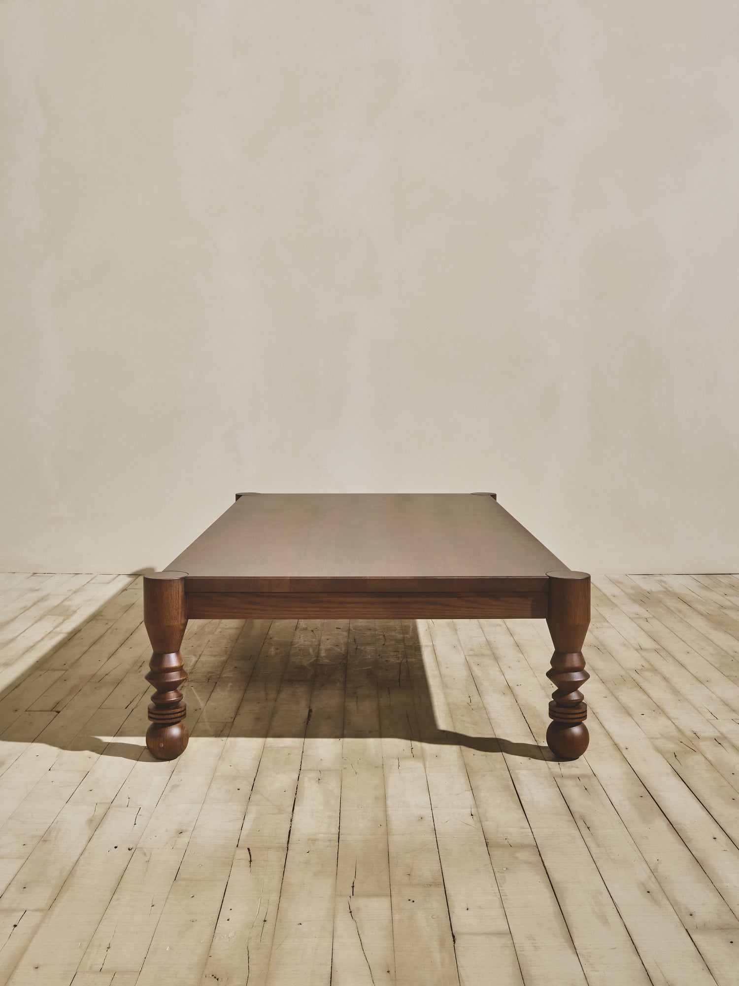 Side view of the natural wood NBL Dining Room Table.