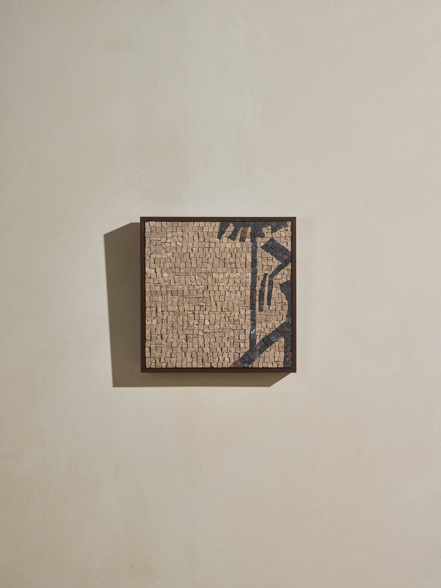 Mosaic square stone art piece with beige and black details and wooden framing.