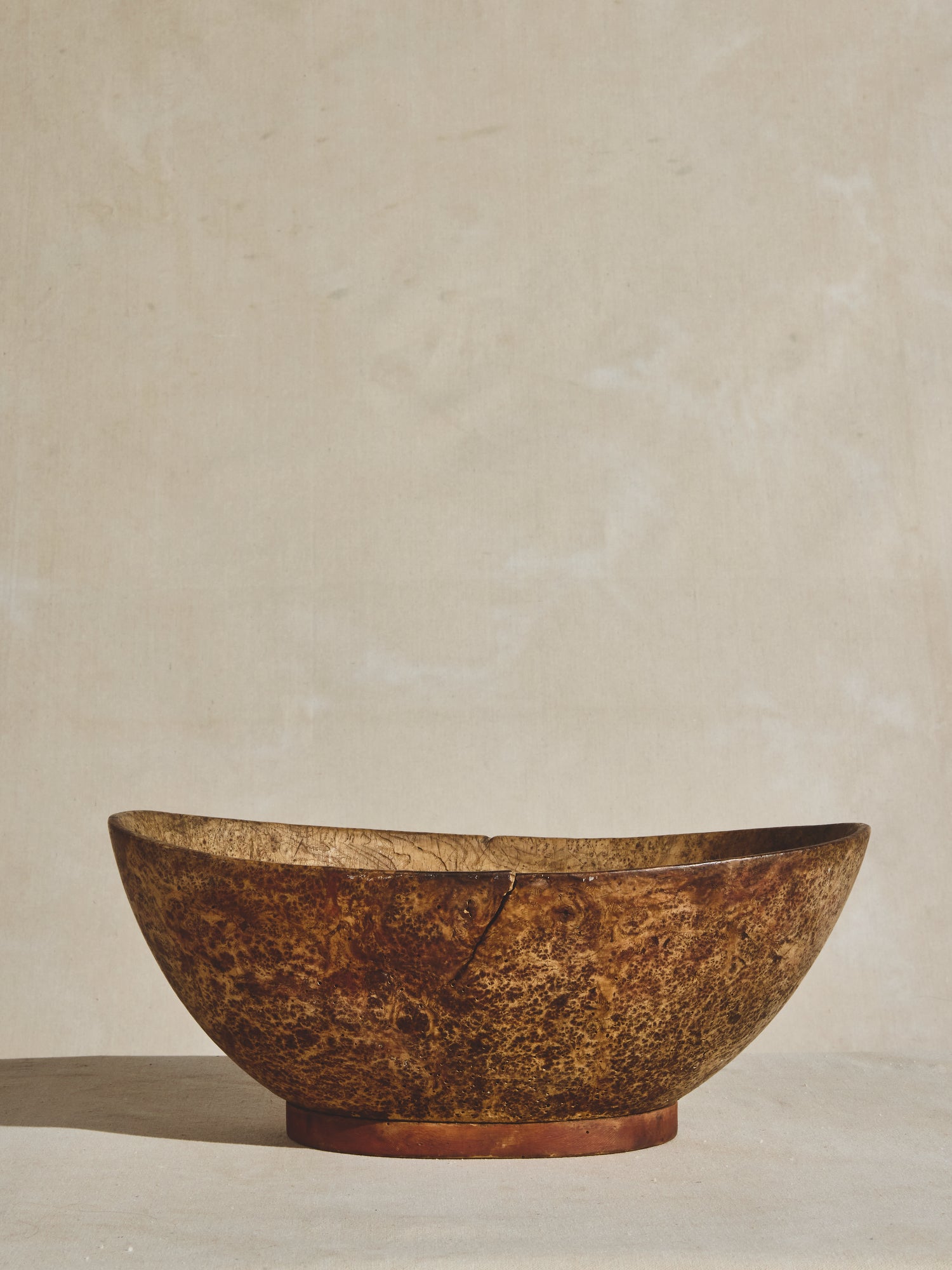 A large antique burled wood bowl