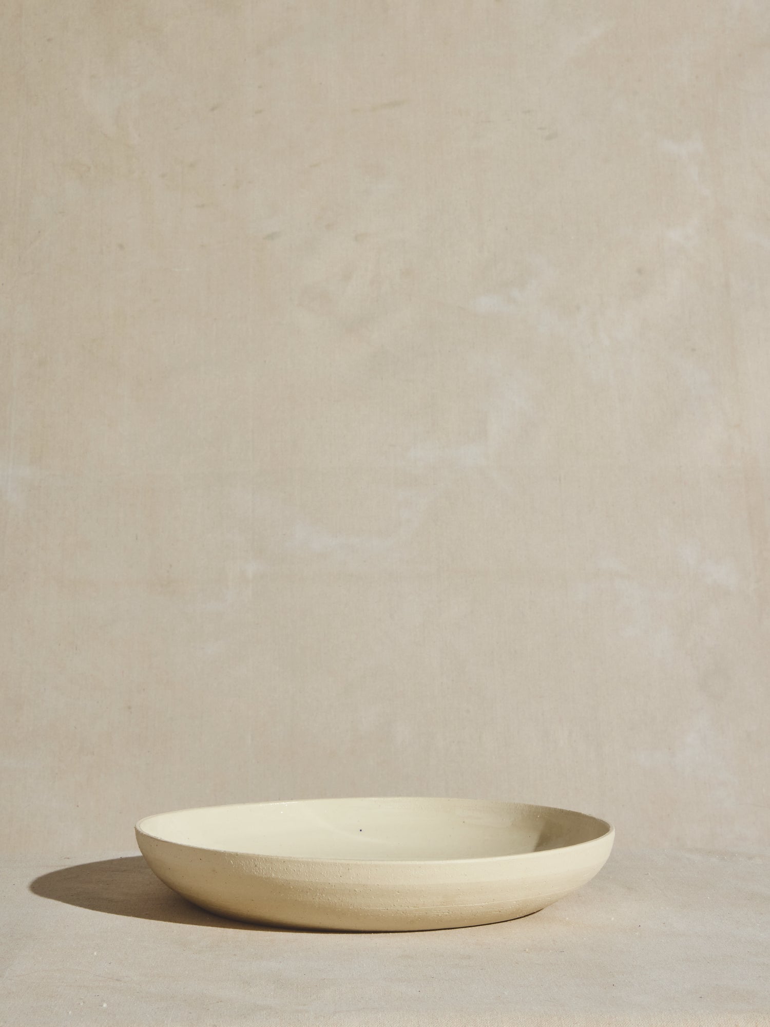 Natural exterior shell and glazed interior thrown salad bowl.