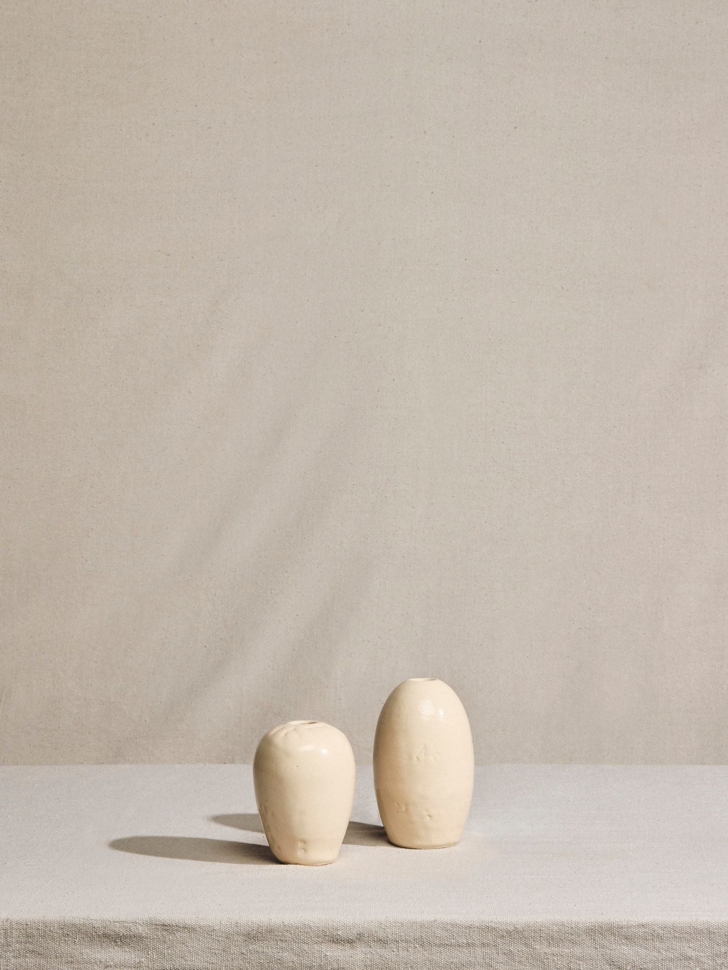 Pair of Cream Glazed Mini Vases